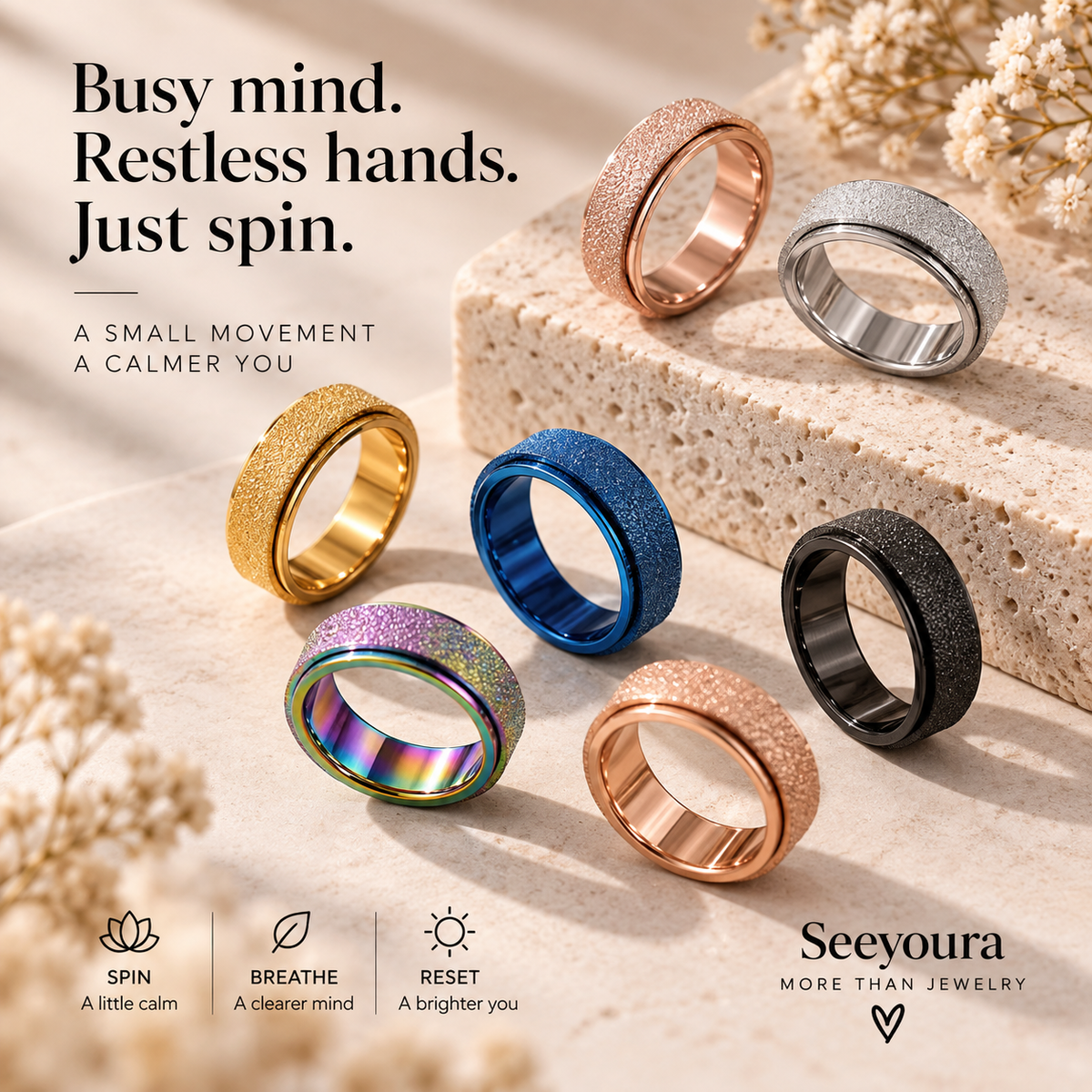 Six Seeyoura magnetic spinner rings in various colors (gold, blue, rose gold, black, silver, and iridescent) displayed on a textured stone slab with dried flowers. The image includes marketing text and feature icons at the bottom.