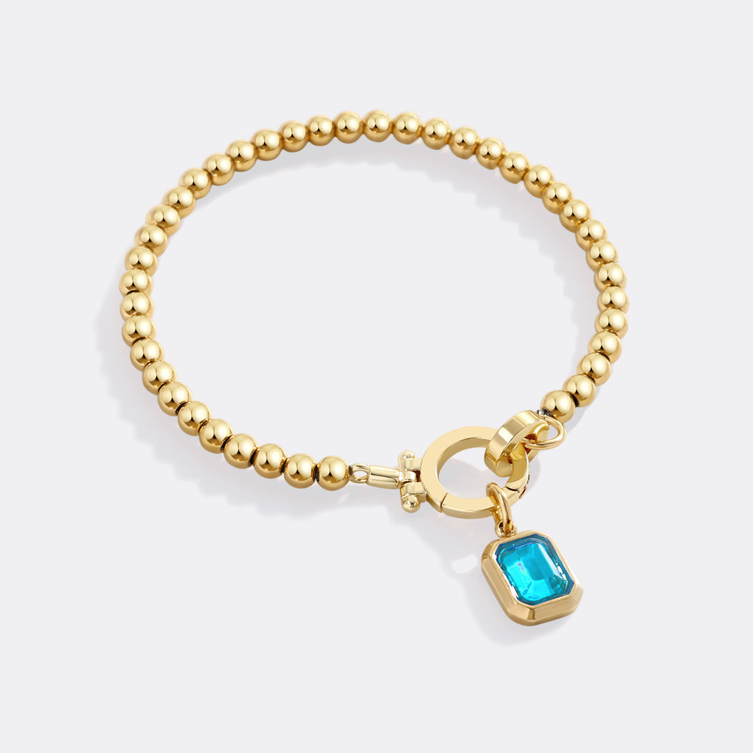 Mint Beaded Bracelet with Baguette Birthstone Charm in December Blue Topaz, gold by Seeyoura