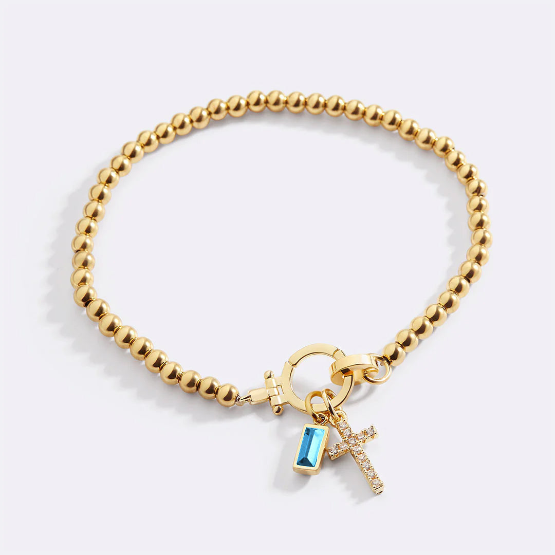 Cross Charm Birthstone Bracelet in blue-topaz-december by Seeyoura