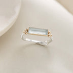 Blue Baguette Zirconia Ring for Women in a soft neutral setting
