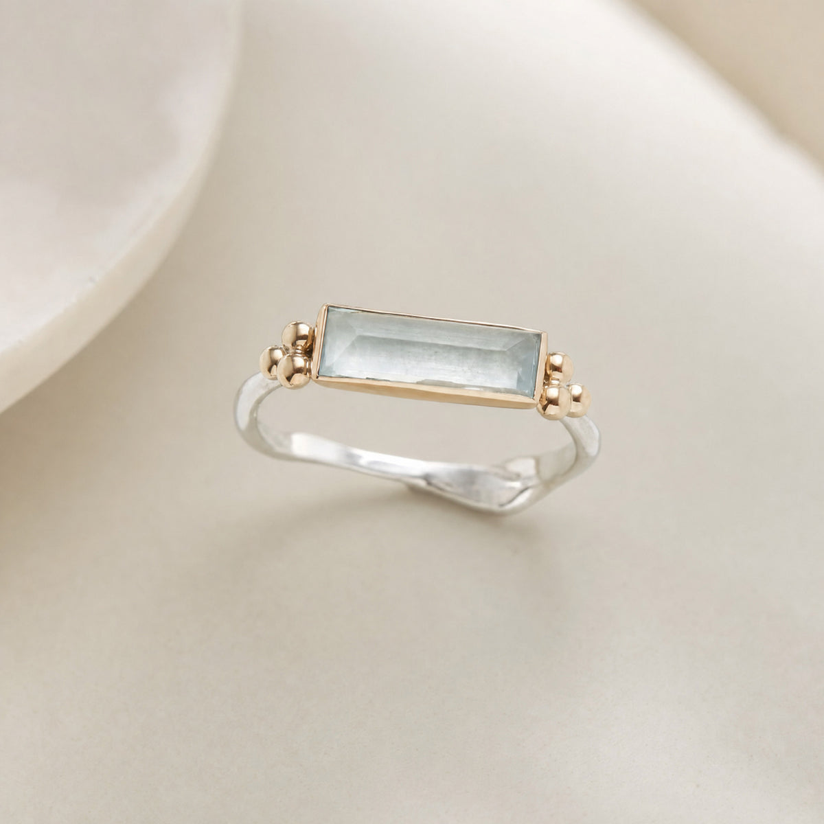 Blue Baguette Zirconia Ring for Women in a soft neutral setting
