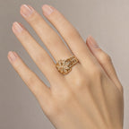 Flower Zirconia Ring — Gold worn on a hand with a light skin tone