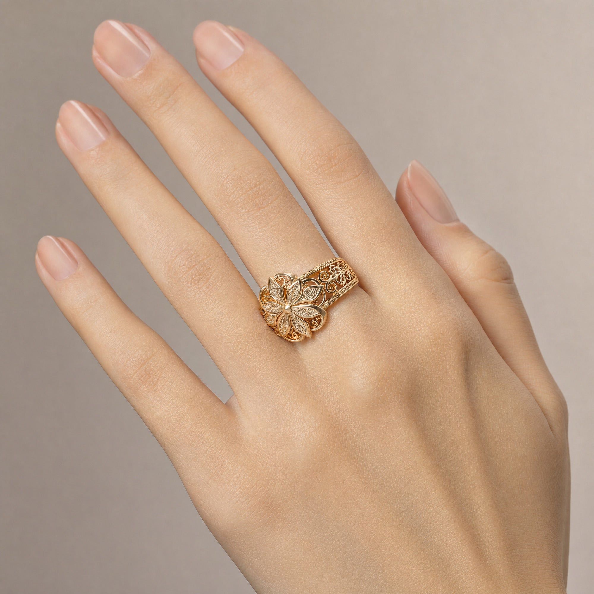 Flower Zirconia Ring — Gold worn on a hand with a light skin tone
