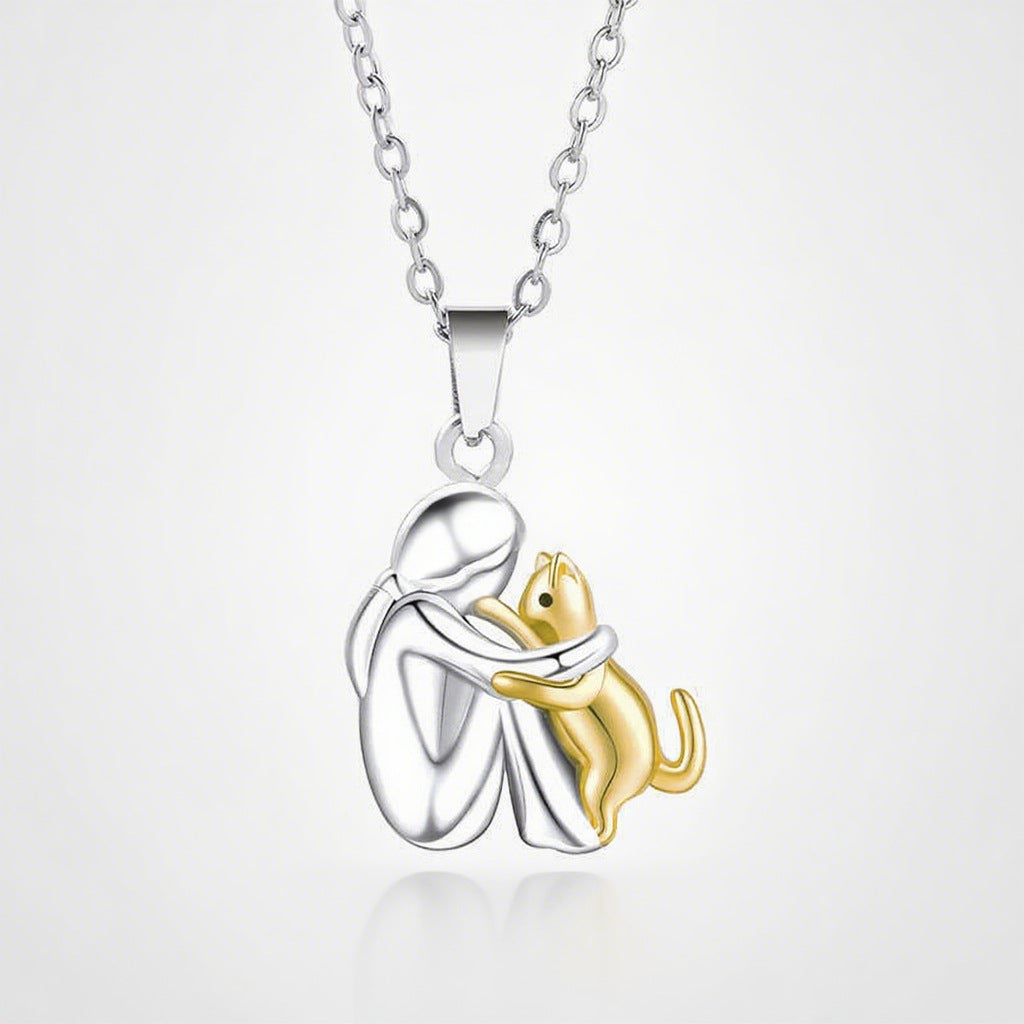 Girl Hugging Cat Necklace in girl-with-cat-gold-necklace by Seeyoura