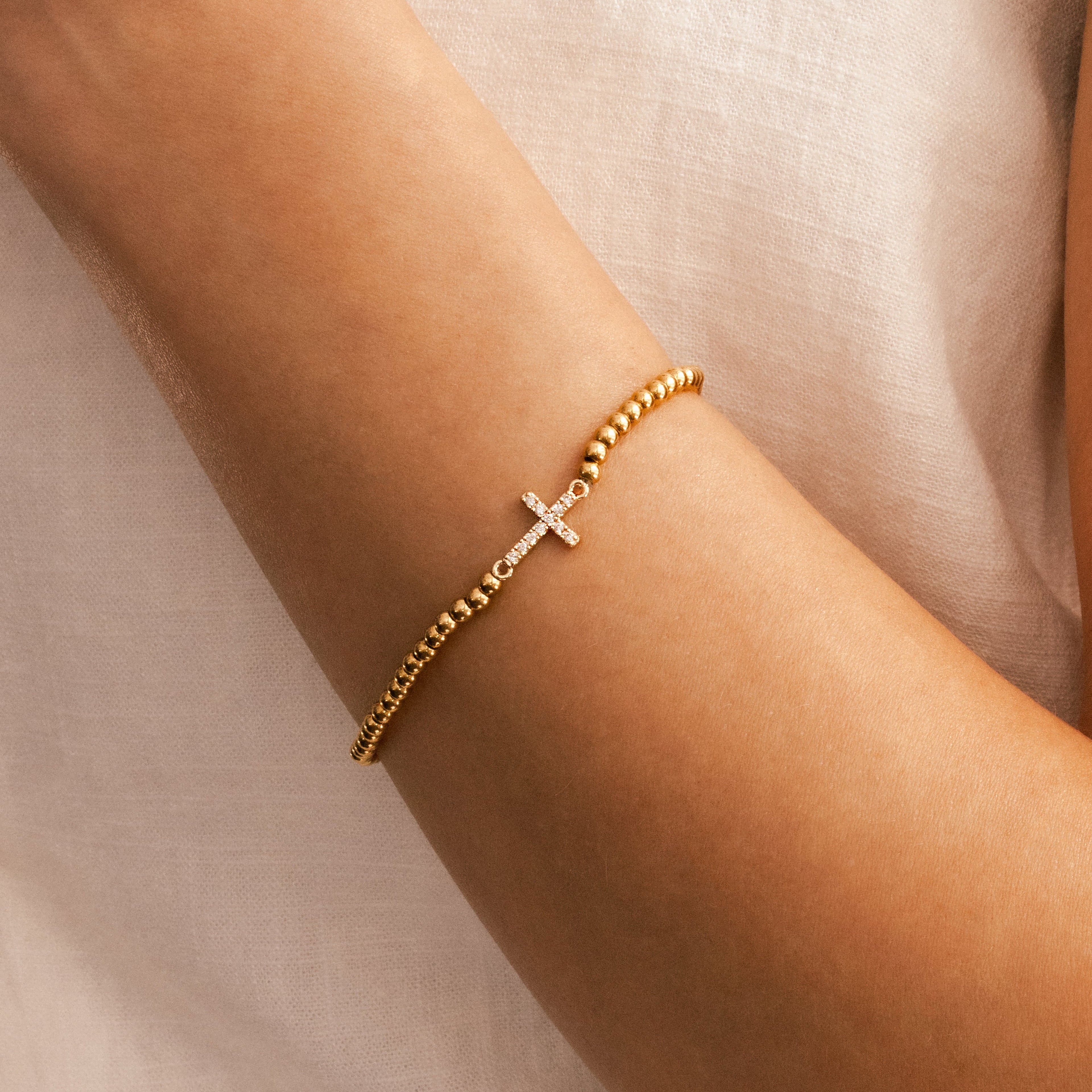 Gold Beaded Cross Stretch Bracelet by Seeyoura