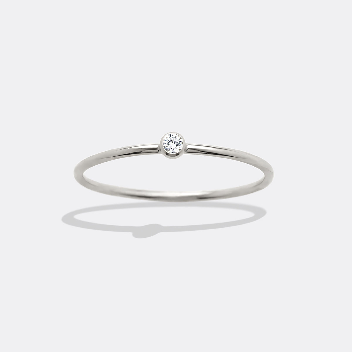 Minimalist Bezel-Set April Birthstone Stacking Band by Seeyoura
