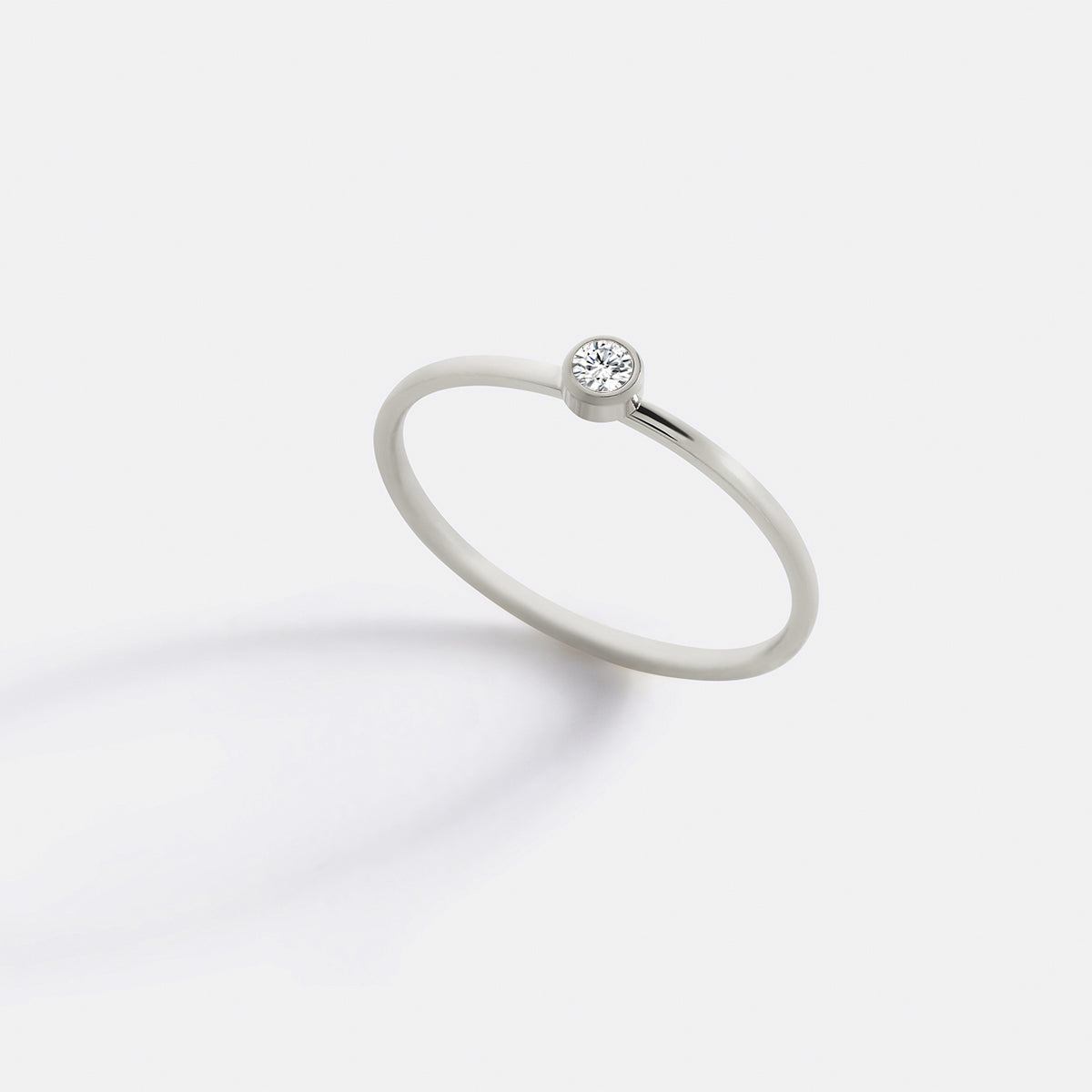 Minimalist Bezel-Set April Birthstone Stacking Band in silver by Seeyoura