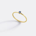 Minimalist Bezel-Set December Birthstone Stacking Band in gold by Seeyoura