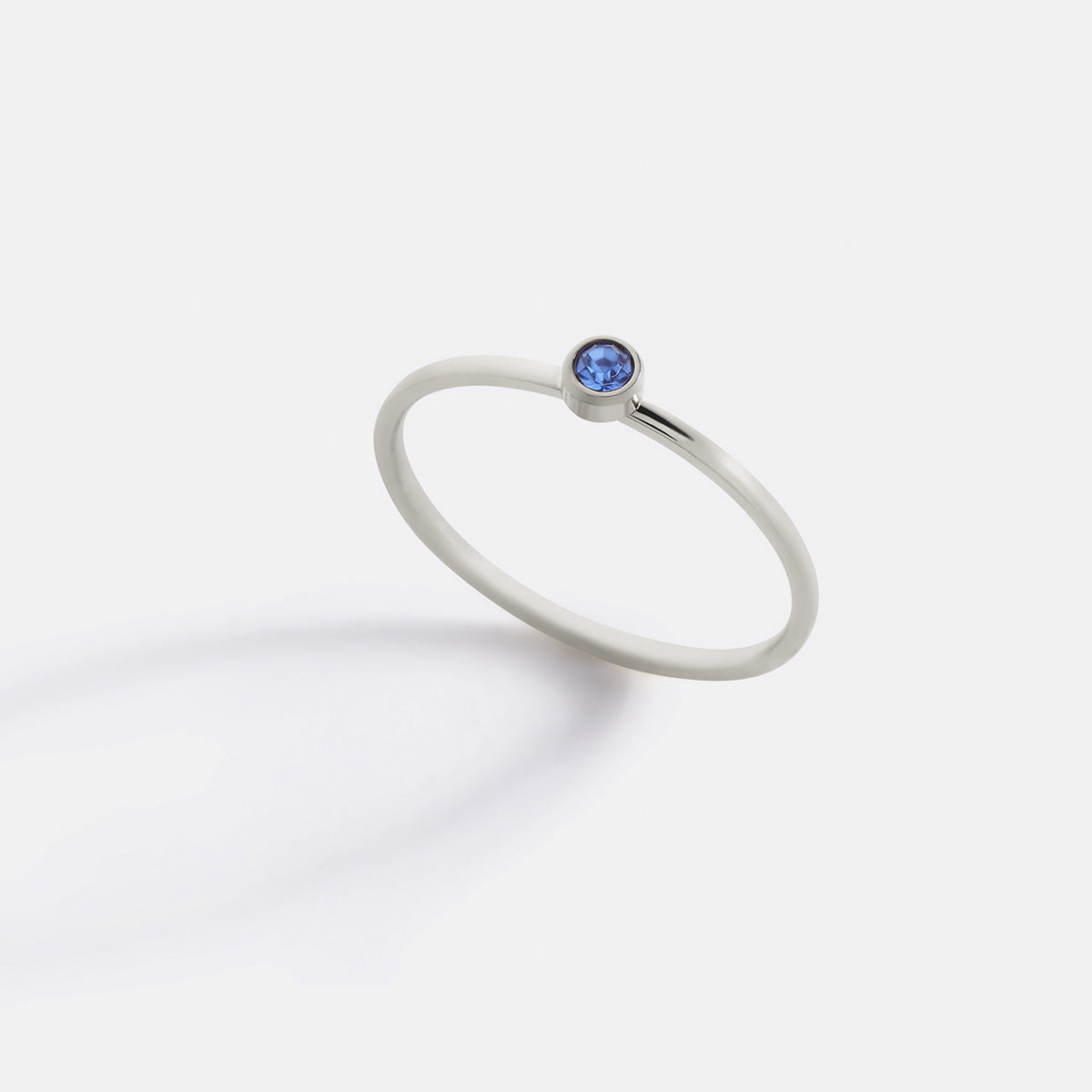 Minimalist Bezel-Set December Birthstone Stacking Band in silver by Seeyoura