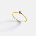 Minimalist Bezel-Set February Birthstone Stacking Band in gold by Seeyoura