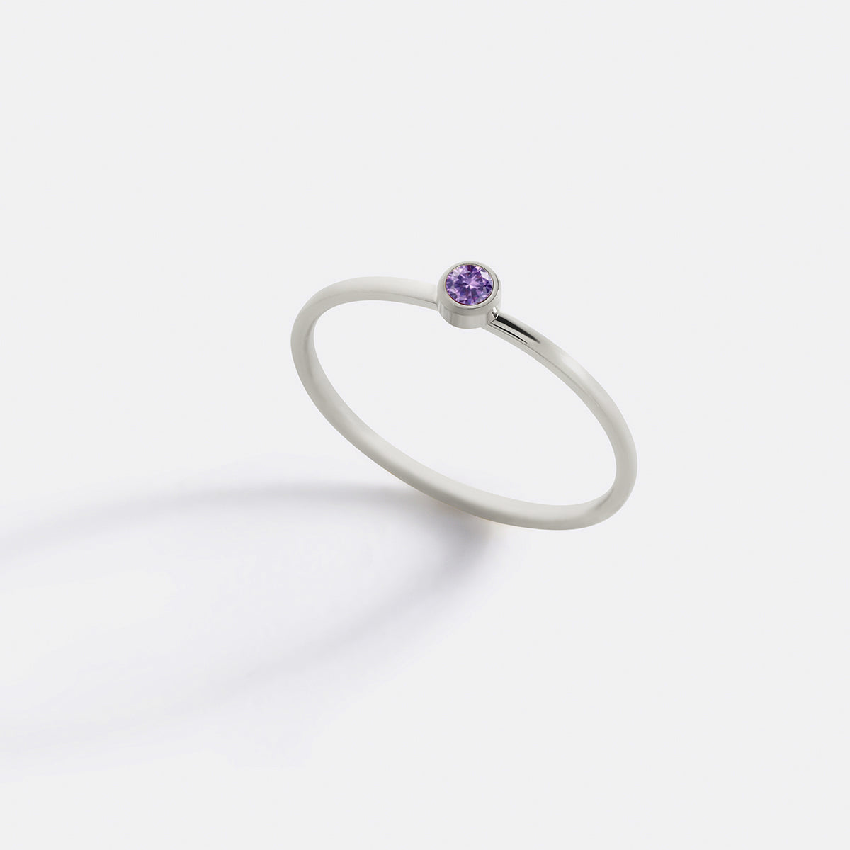 Minimalist Bezel-Set February Birthstone Stacking Band in silver by Seeyoura