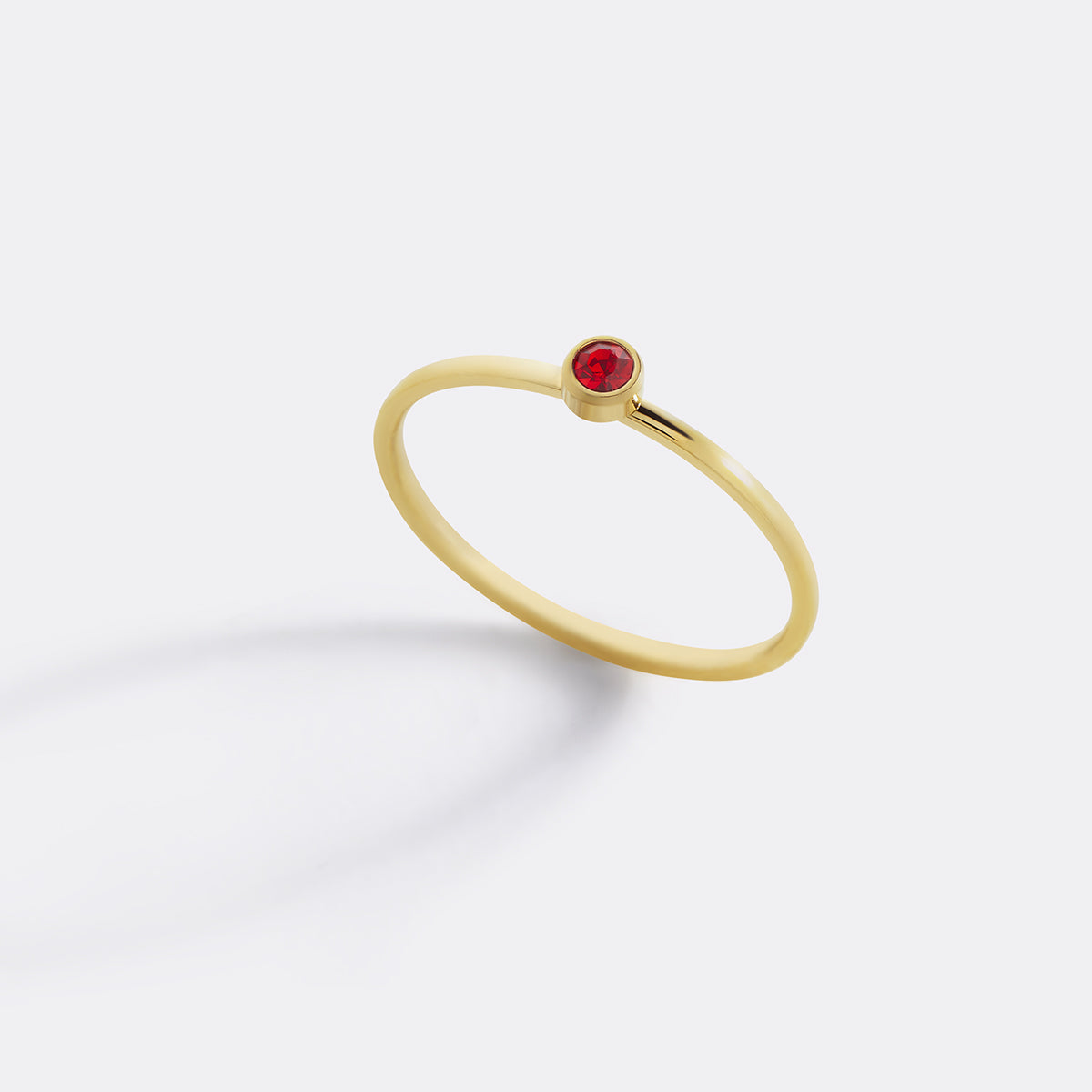 Minimalist Bezel-Set January Birthstone Stacking Band in gold by Seeyoura