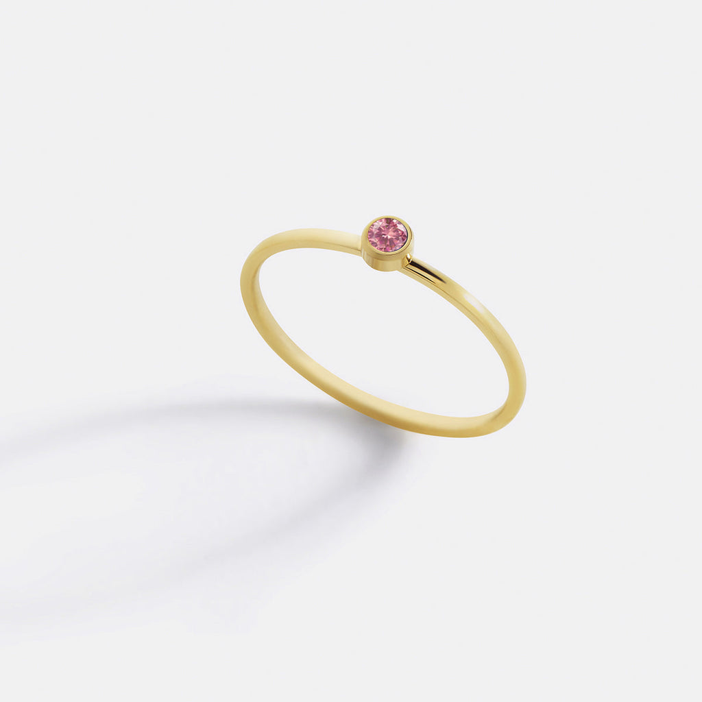 Minimalist Bezel-Set July Birthstone Stacking Band in gold by Seeyoura