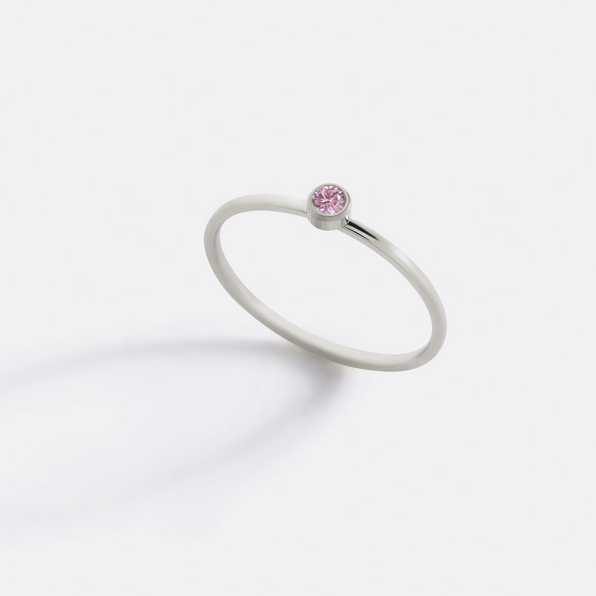 Minimalist Bezel-Set October Birthstone Stacking Band in silver by Seeyoura