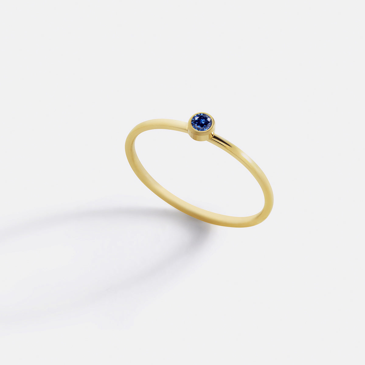 Minimalist Bezel-Set September Birthstone Stacking Band in gold by Seeyoura