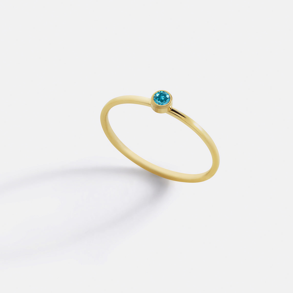 Minimalist Bezel-Set March Birthstone Stacking Band in gold by Seeyoura