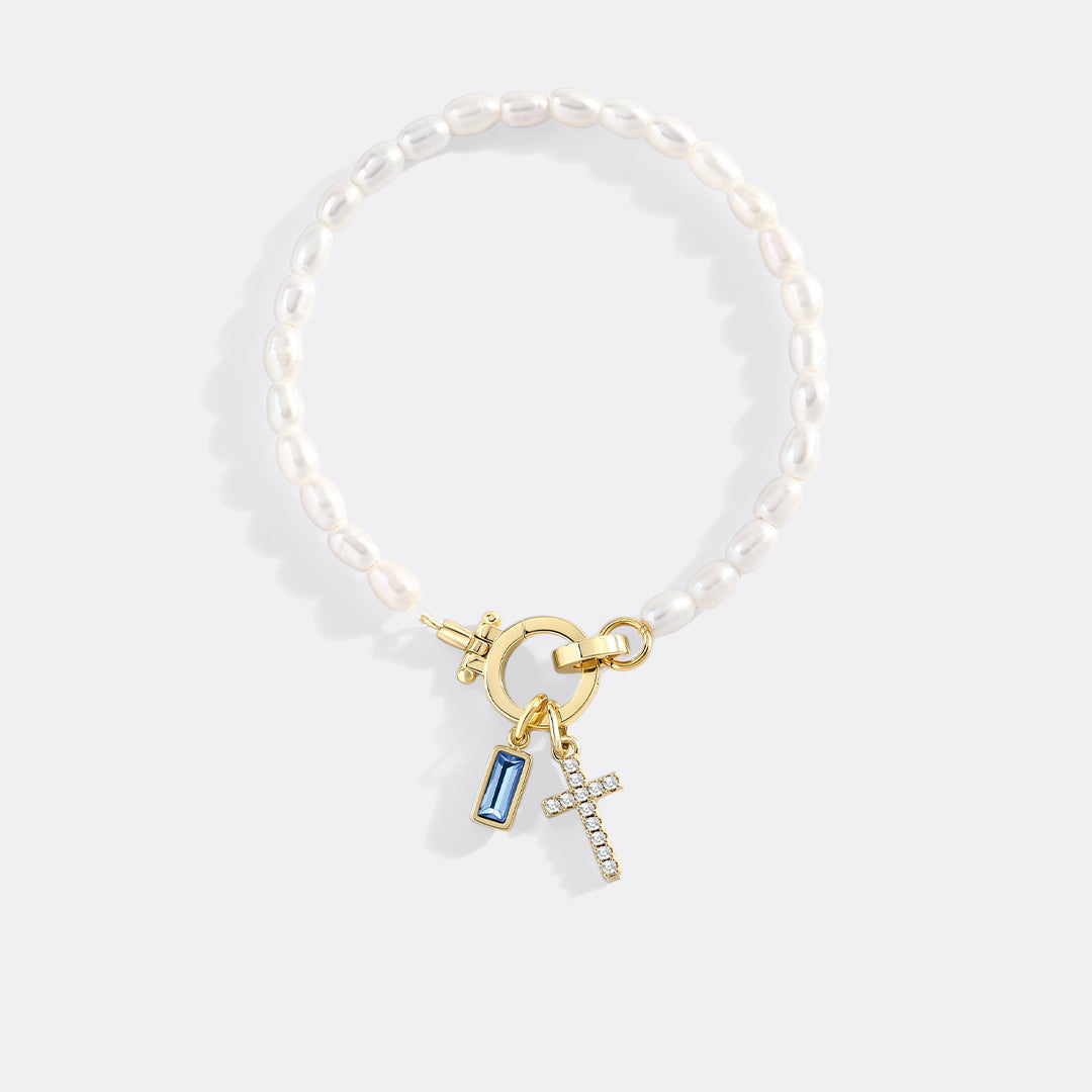 Pearl Cross Charm Bracelet in march-aquamarine by Seeyoura