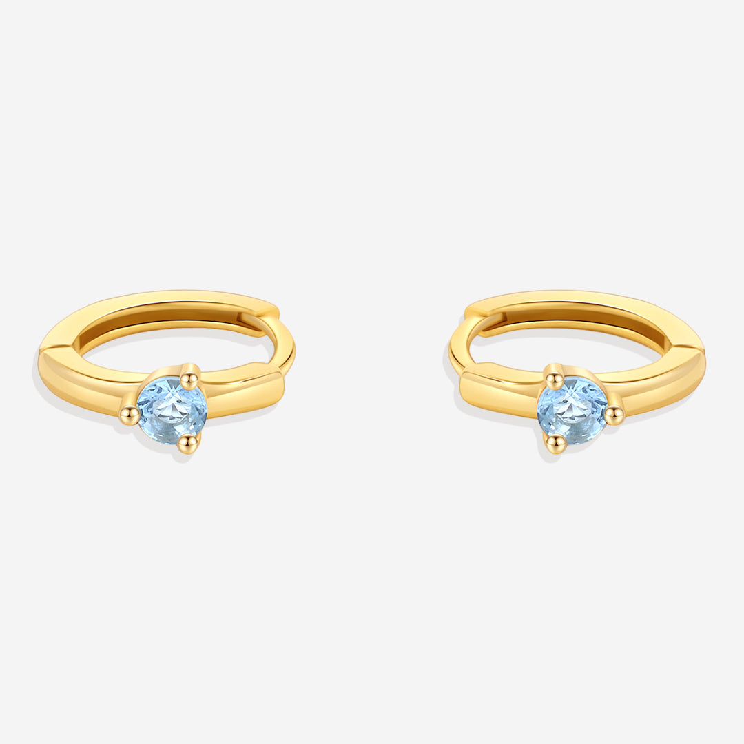 Solitaire Birthstone Huggie Hoop Earrings in blue-topaz-december, 18k Gold Over Sterling Silver by Seeyoura
