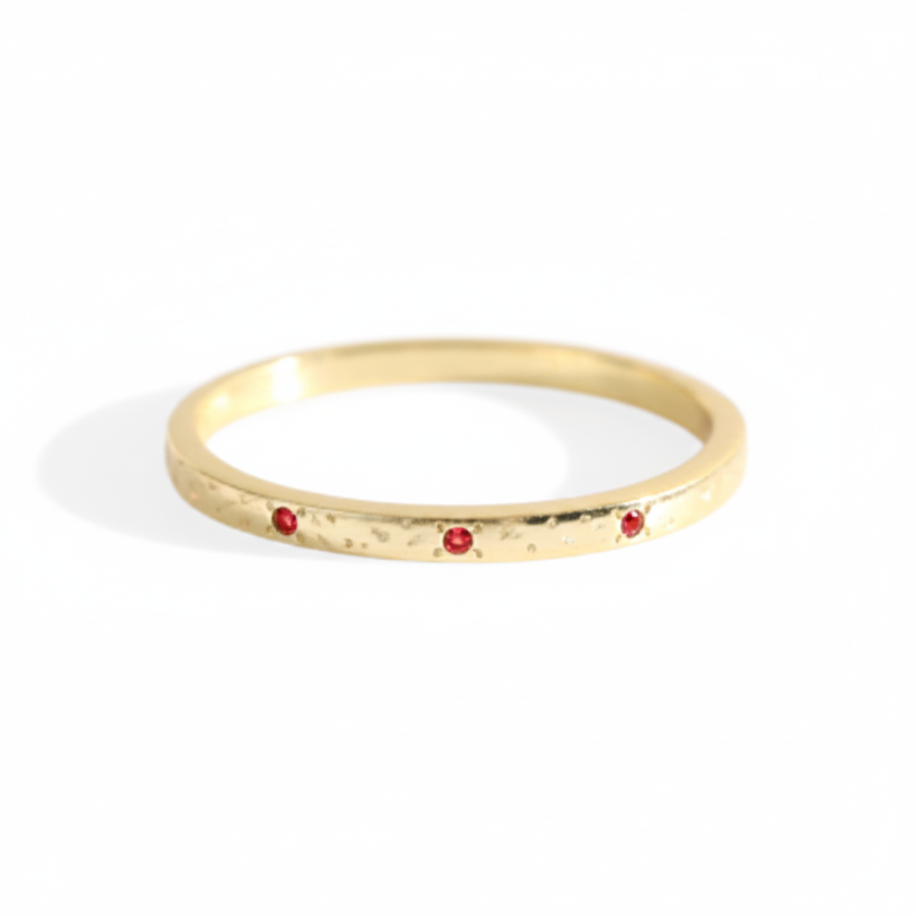 Narrow Textured Gold Birthstone Band in january-garnet by Seeyoura